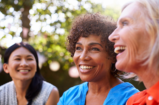 A group of smiling older women with dental implants from Masci, Hale & Wilson Advanced Aesthetic and Restorative Dentistry in Montgomery, NY