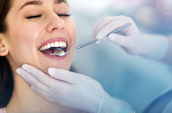 Woman getting dental exam, at Montgomery, NY office.